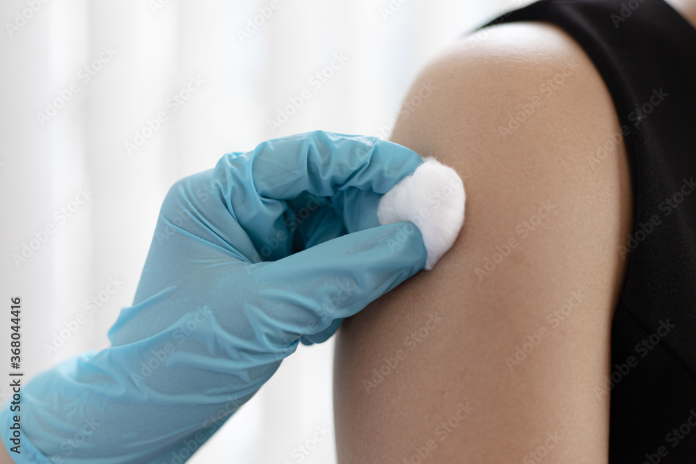 Doctor vaccinated against new strains of the virus for the patient to build immunity. Doctor vaccinated against new strains of the virus for the patient to build immunity.