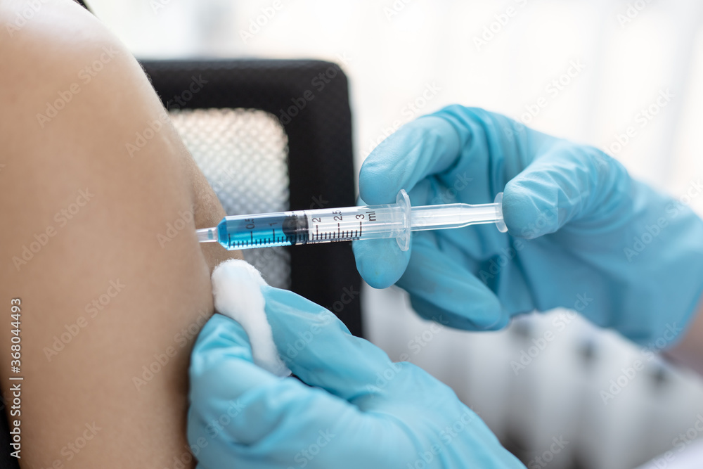 Doctor vaccinated against new strains of the virus for the patient to build immunity. Doctor vaccinated against new strains of the virus for the patient to build immunity.
