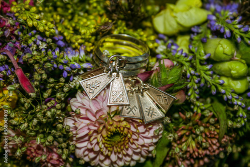 Traditional Latvian unmarried women silver ring or seven day/engagement ring with Latvian signs on a flower bouquet.