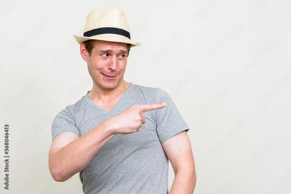 Portrait of young handsome tourist man ready for vacation Portrait of young handsome tourist man ready for vacation