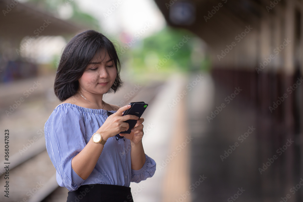 young woman texting on cell phone young woman texting on cell phone