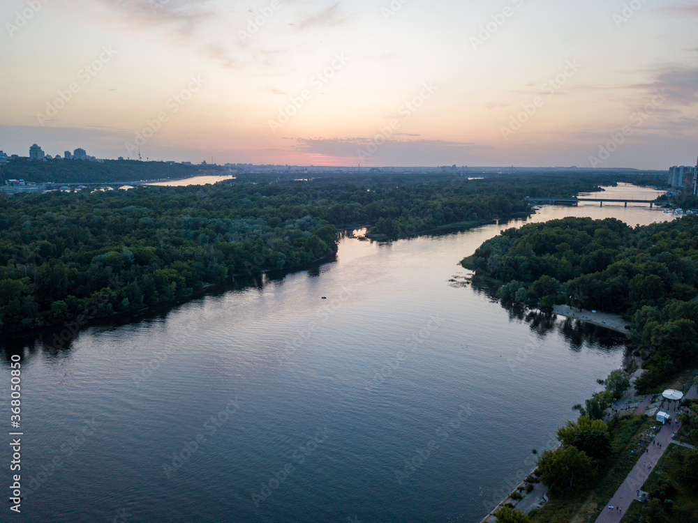 Sunset over the Dnieper River in Kiev. Aerial drone view. Sunset over the Dnieper River in Kiev. Aerial drone view.