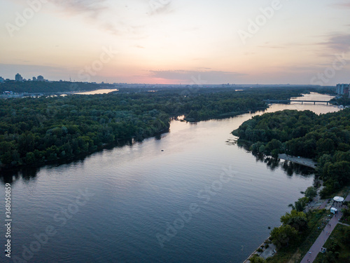Sunset over the Dnieper River in Kiev. Aerial drone view.