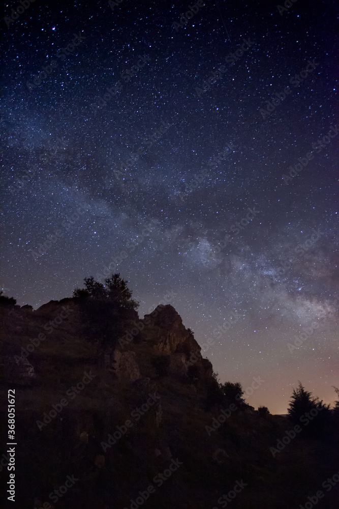 Dark night with a sky full of stars and the beautiful Milky Way. Night landscape wonder of nature.