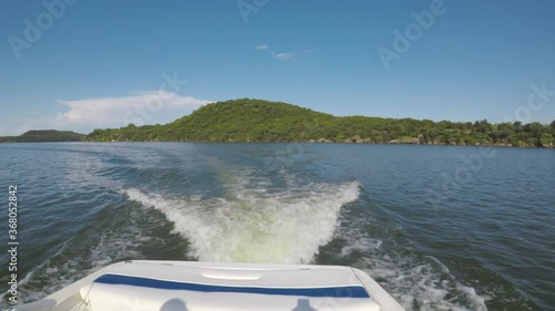 POV. point of view  the waves and foaming water behind the boat on Possum Kingdom Lake.