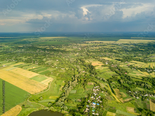 Aerial drone view. Agricultural fields near a village in Ukraine.