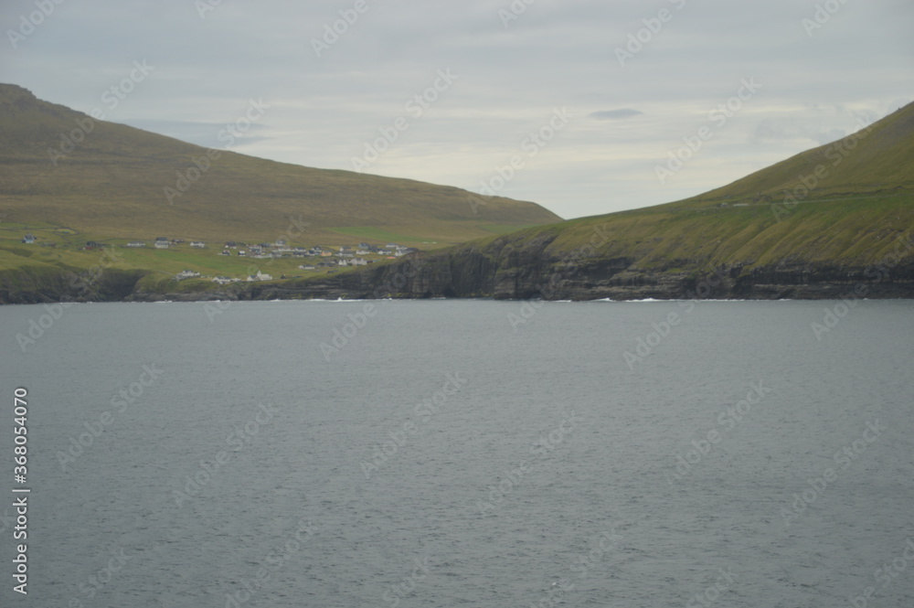 The stunning and dramatic coast and mountains on the Faroe Islands The stunning and dramatic coast and mountains on the Faroe Islands