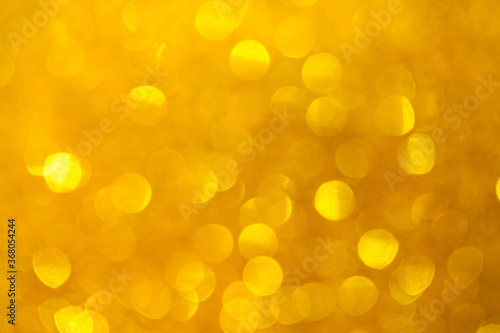 Golden bokeh background, Abstract background bokeh blurred, Shiny bokeh light effect.