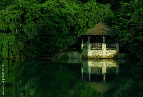gazebo with reflection in a pond