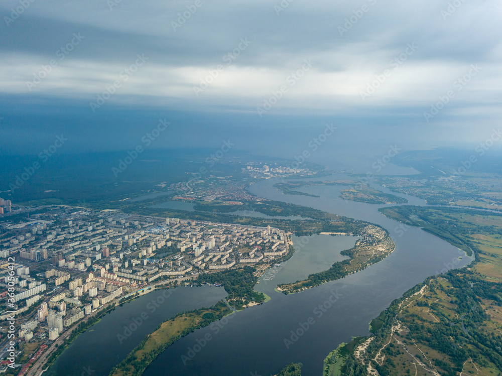 Aerial view of the Dnieper River and the city of Kiev from above. Summer sunny day.