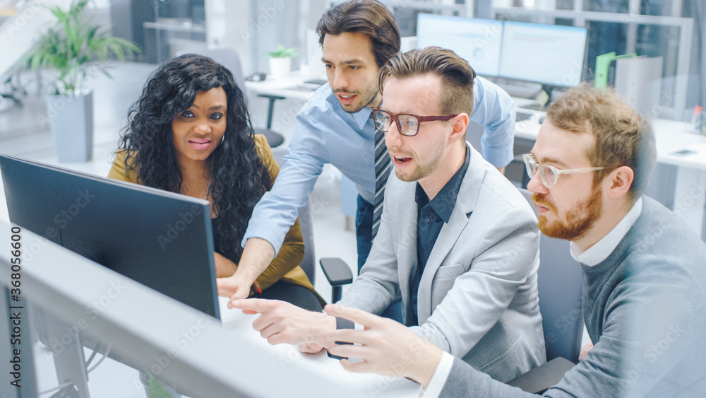 Fototapeta premium In Modern Office: Diverse Team of Businessmen and Businesswoman Work on Computer, Having Discussion, Successfully Finding Problem, Applaud and Cheerfully Celebrate. Happy and Motivated Businesspeople 