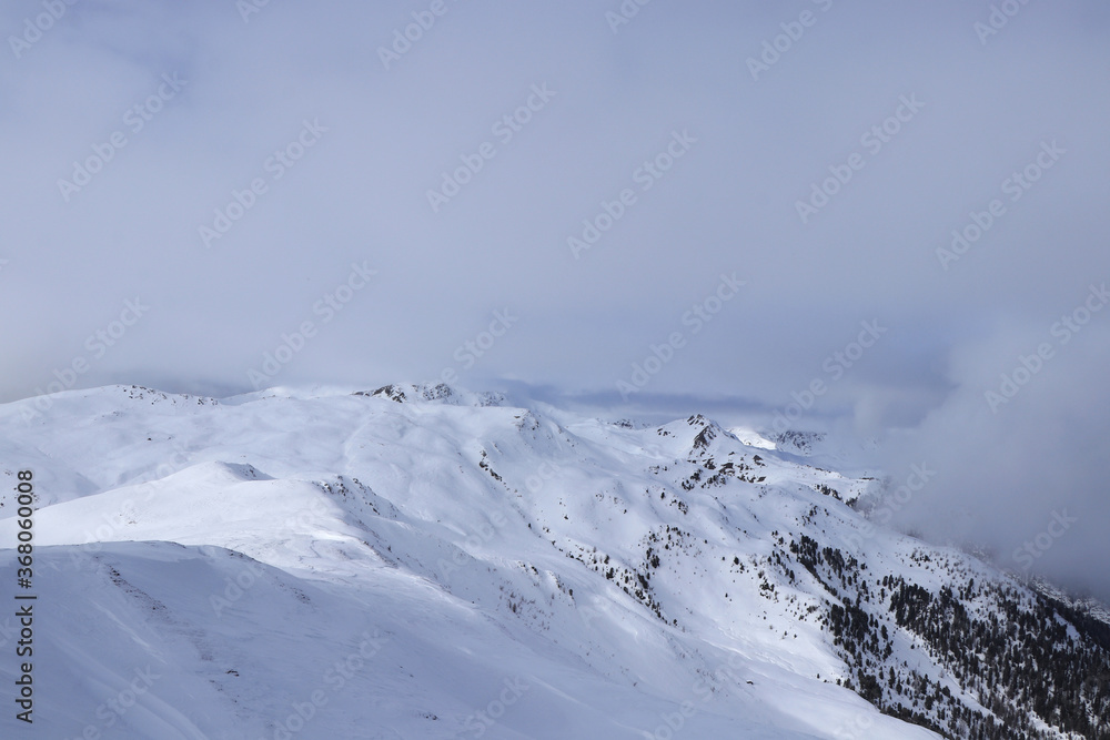 Snowy plains in the west of Austria in Tyrol, not far from the Italian border. View from the highest cable car station in Sillian ski resort on Hochrast peak, Gumriaul mountain Snowy plains in the west of Austria in Tyrol, not far from the Italian border. View from the highest cable car station in Sillian ski resort on Hochrast peak, Gumriaul mountain