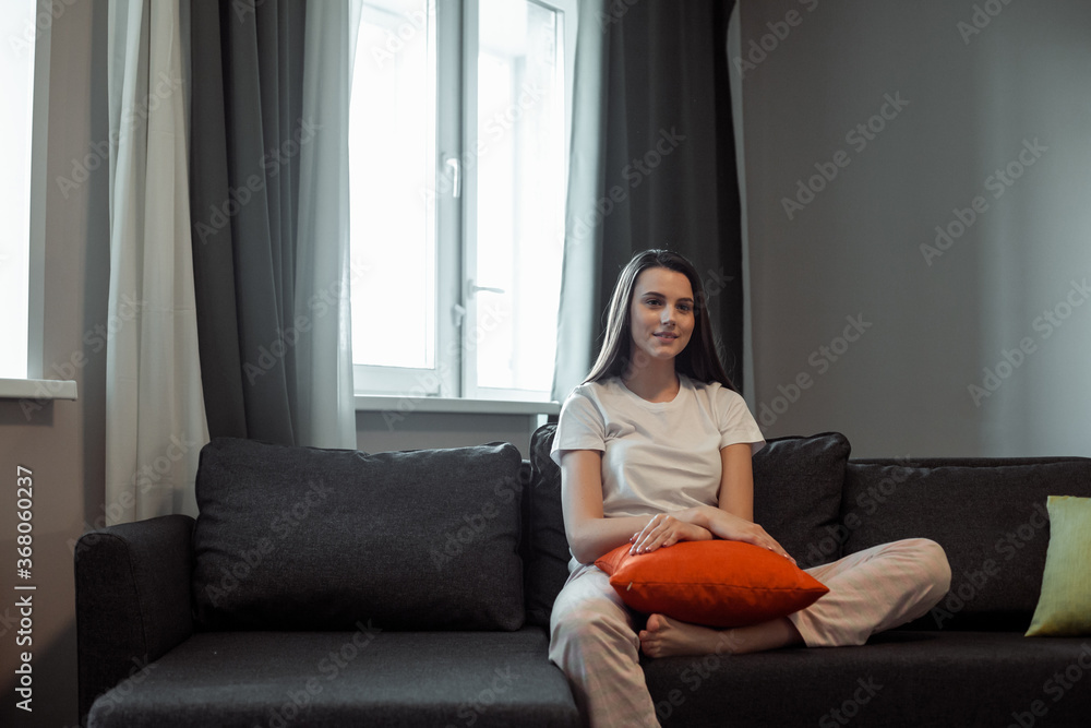 Young woman pretty relaxing on couch in living room
