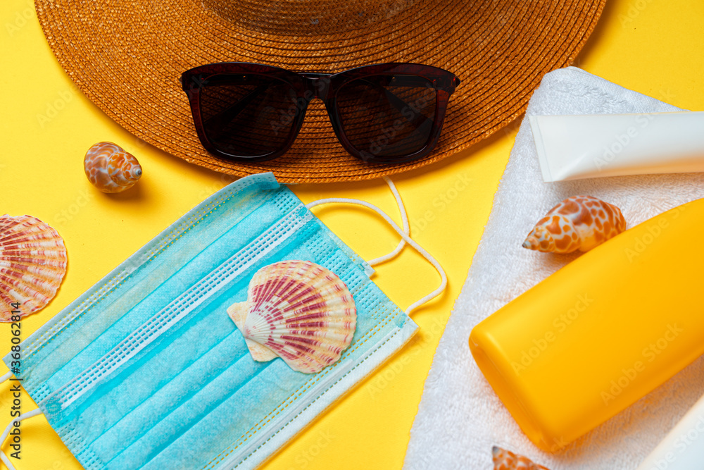 Sunscreen cream and protective mask. Coronavirus summer concept - obrazy, fototapety, plakaty 