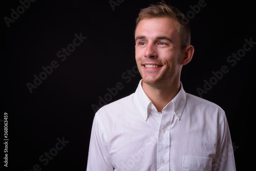 Portrait of young handsome businessman with blond hair