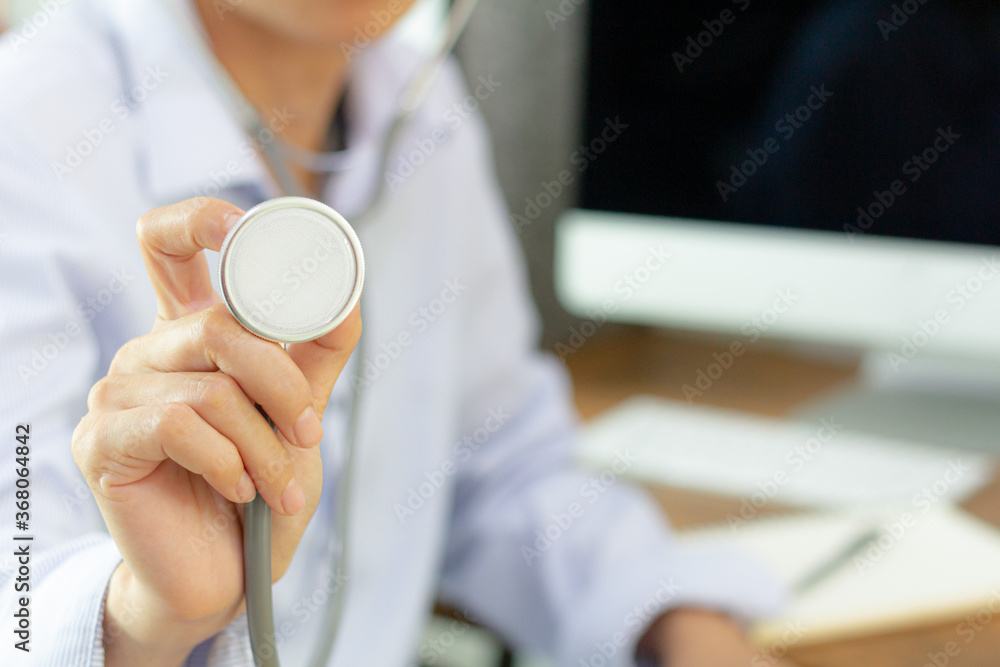 Medicine concept: Doctor with a stethoscope in the hands on hospital background, physician ready to examine and help patient.