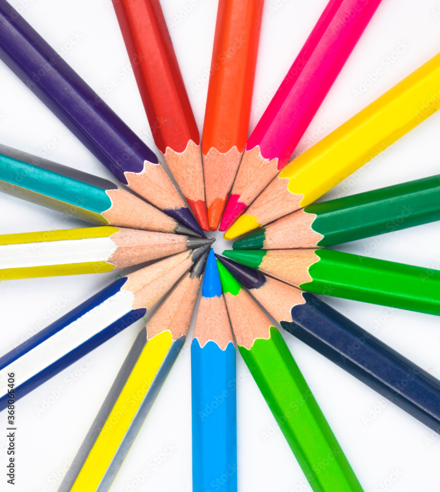 Round circle made with many different colored wood pencil crayons on a paper Round circle made with many different colored wood pencil crayons on a paper
