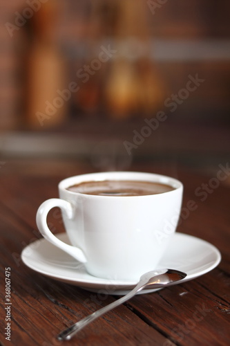 Coffee Cup on wooden plank table