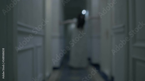Phantom of possessed woman in corridor, creepy nightmare, demonic possession