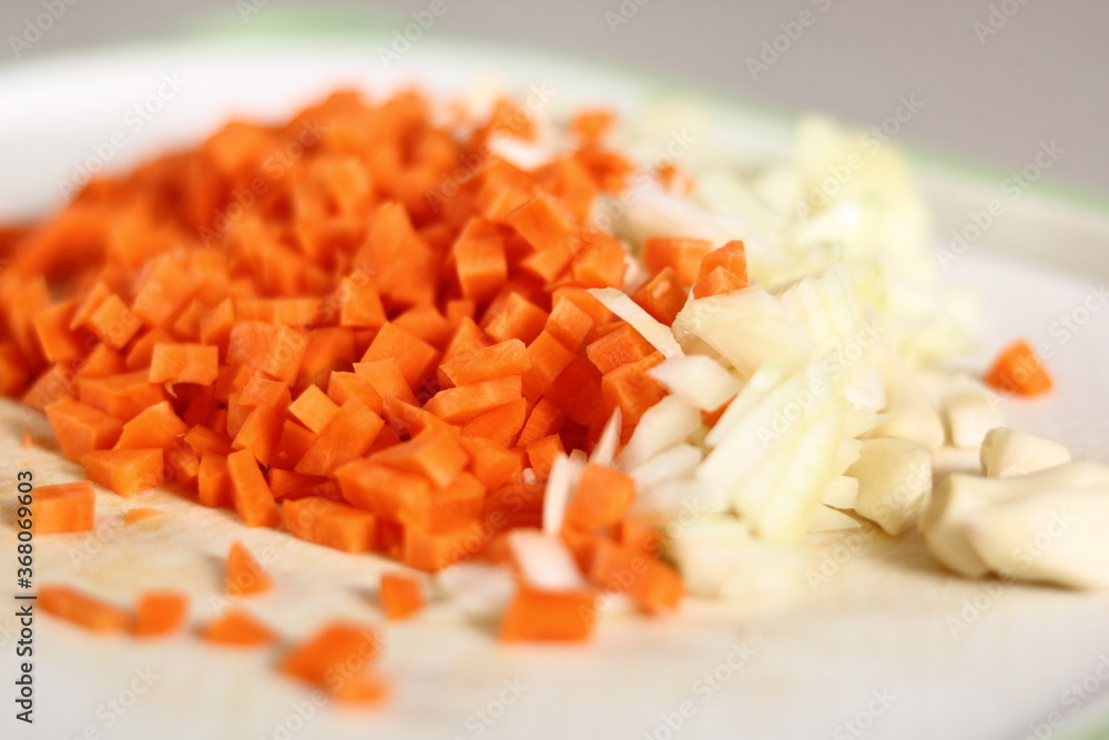 Diced carrot, onion and garlic. Making Lasagna Bolognese Series. Diced carrot, onion and garlic. Making Lasagna Bolognese Series.