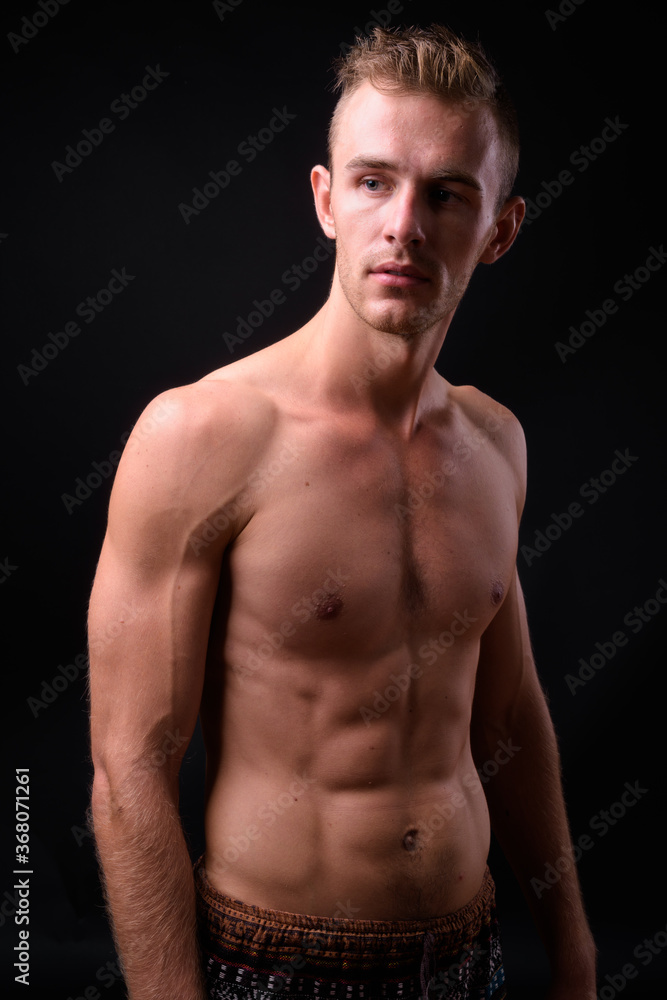 Portrait of young handsome shirtless man with blond hair Portrait of young handsome shirtless man with blond hair