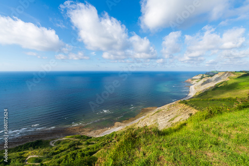 Panoramic of the coast with blue sky and white clouds in Elorriaga, Basque Country, Spain, horizontal