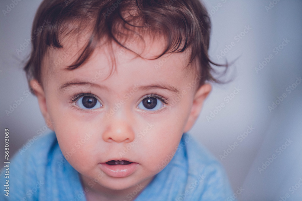 portrait of a baby boy with long hair portrait of a baby boy with long hair