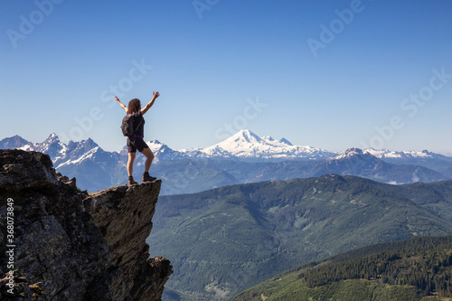 Adventurous Person Hiking in the Canadian Mountains during a sunny summer morning. Taken on the Trail to Cheam Peak in Chilliwack, East of Vancouver, British Columbia, Canada. © edb3_16