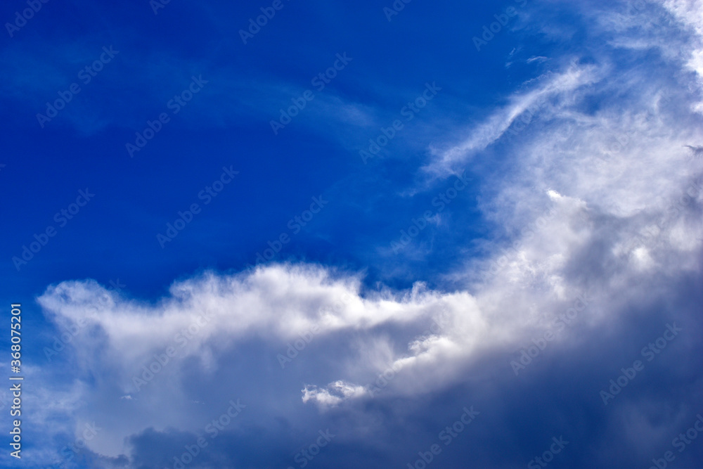 The stormy beauty of the blue Cumulus clouds in summer