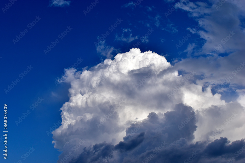 The stormy beauty of the blue Cumulus clouds in summer