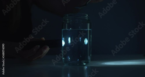 Tyndall effect science experiment demonstration of light scattering photo