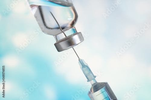 Vaccine medicine bottle and syringe injection use for prevention and treatment of virus infection disease.Medical personnel are preparing vaccines for medical treatment.