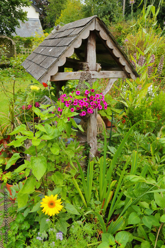Wishing well in beautiful cottage style garden