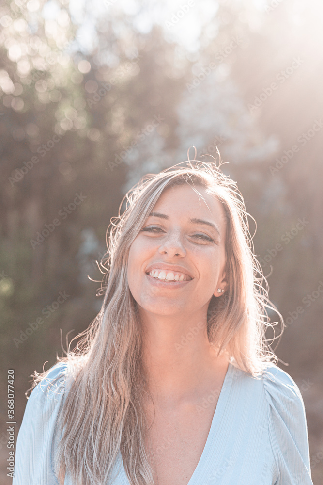 Portrait of a young and attractive caucasian woman near a forest Portrait of a young and attractive caucasian woman near a forest