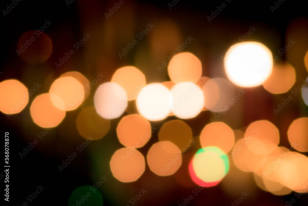 Fototapeta premium Blur the lights on the restaurant. Blurred cafe background with bokeh. orange ,red, light, blue, green, pink.
