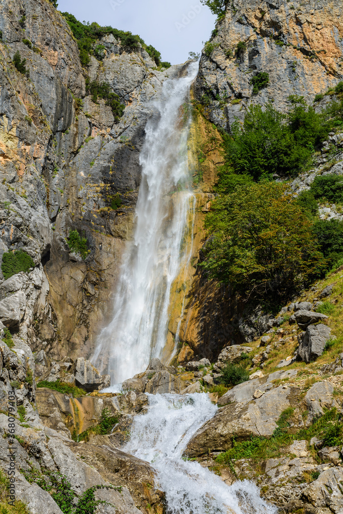 Obraz premium Waterfalls of Tzoumerka. One of two picturesque waterfalls in the mountains of a national park in eastern Tzoumerka, in the vicinity of the village of Kriopigi. Greece