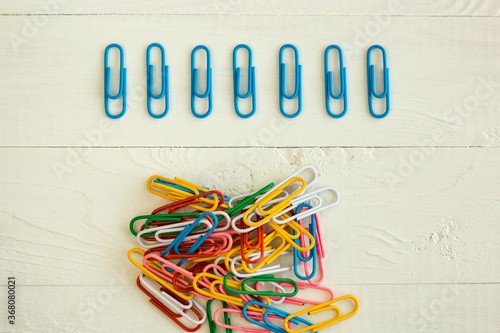 colored paper clips on the white backrground, perfectionism photo