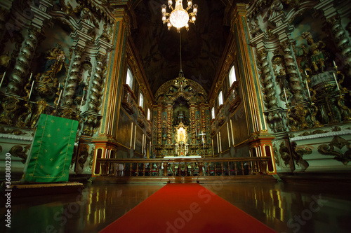  ancient church wide-angle view inside with local saints of faith and christian worship golden green and red details © levi