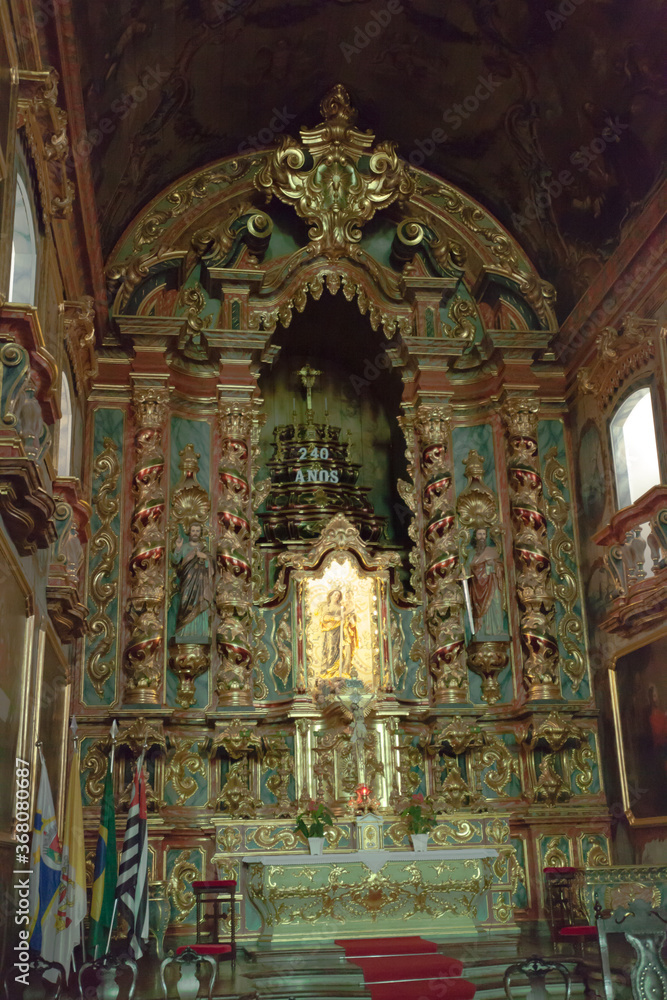 
ancient church wide-angle view inside with local saints of faith and christian worship golden green and red details