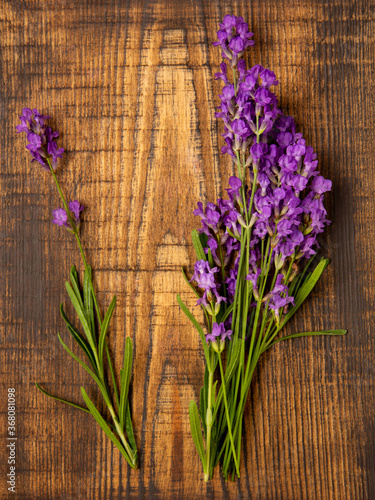 Lavender bouquet on a wooden background. Top view, flat lay.