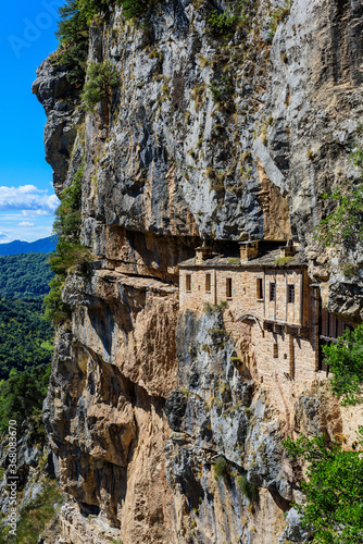 View of Holy Kipinas Monastery. The monastery was built in a cliff overhanging a narrow mountain road and a deep gorge.The complex was built in 1212.  photo