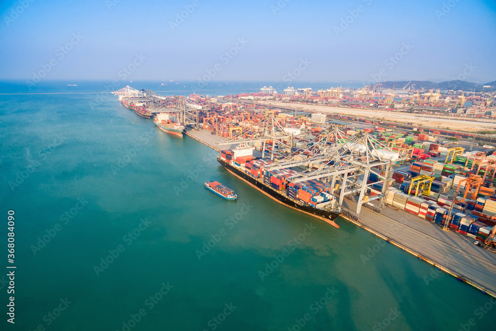 Large container shipping boat at shipping yard main transportation of cargo container  shipping