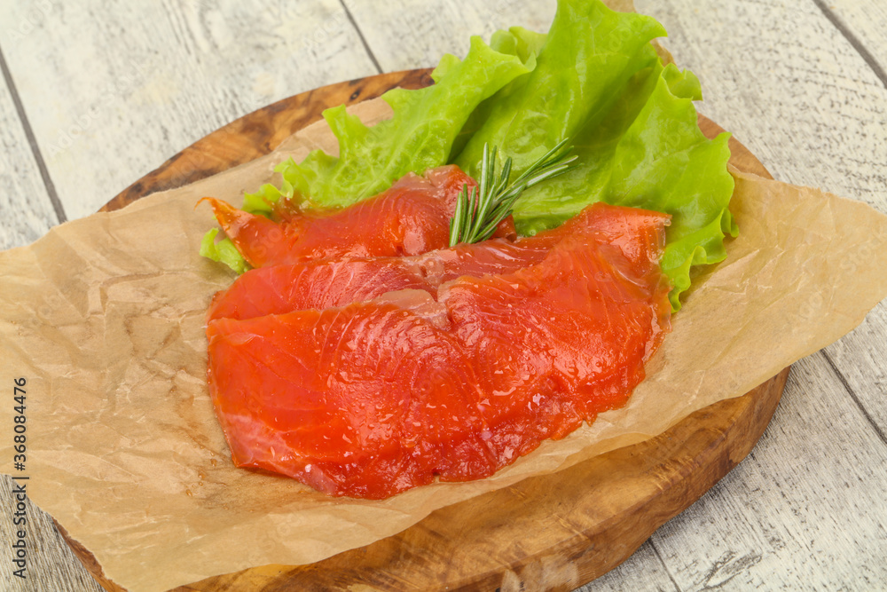Sliced salmon fillet served rosemary Sliced salmon fillet served rosemary