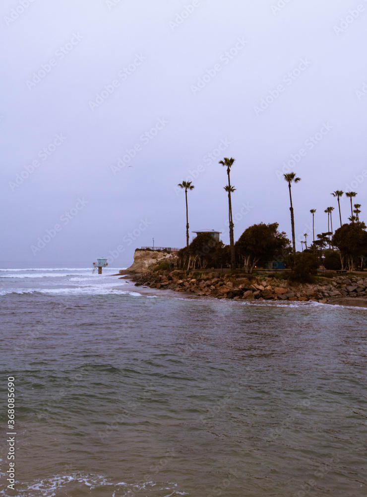 Early morning stormy weather on the Pacific Ocean in Cardiff by the Sea, California. Moody edit, west coast ocean stock