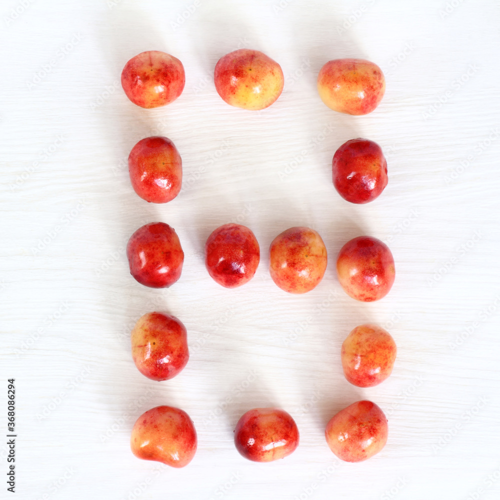 number eight from berries of sweet cherry on light surface, top view. sweet countdown 8 number eight from berries of sweet cherry on light surface, top view. sweet countdown 8