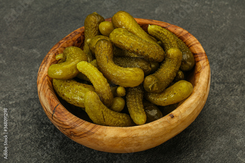 Pickled gherkin in the bowl