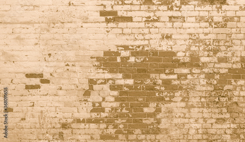The background of the old beige brick wall for design interior and various scenes or as a background for video interviews.