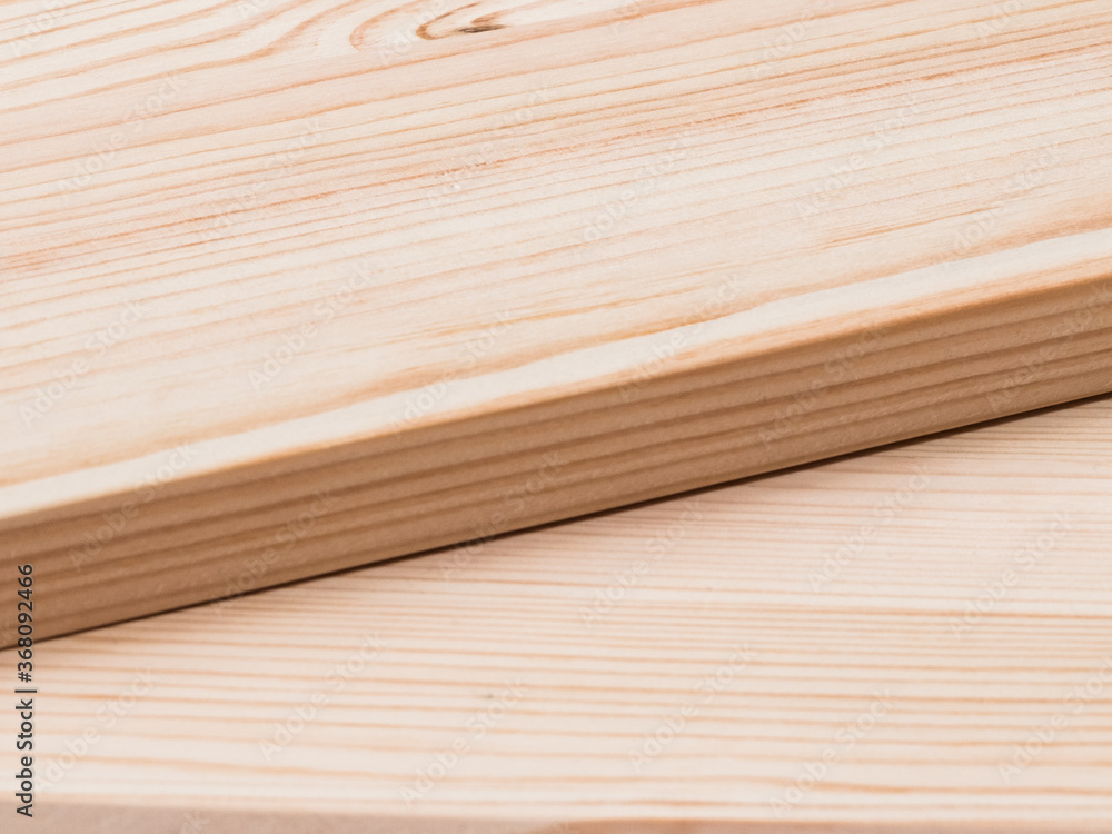 Close-up of blank planks lying diagonally. Wooden texture.