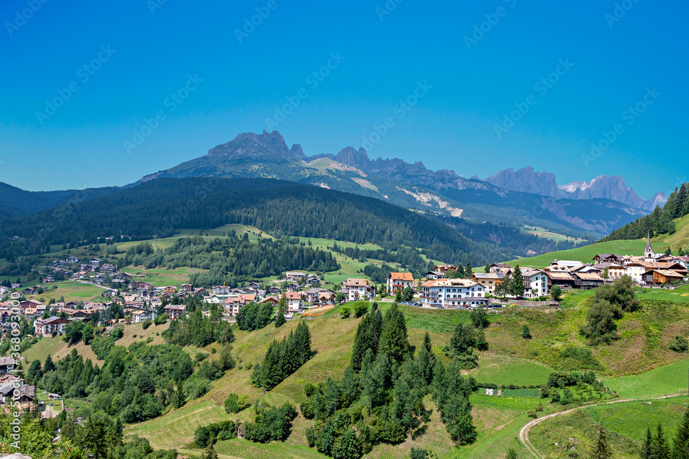 Italy, Dolomites, the Moena village and in the background the Catinaccio mountain