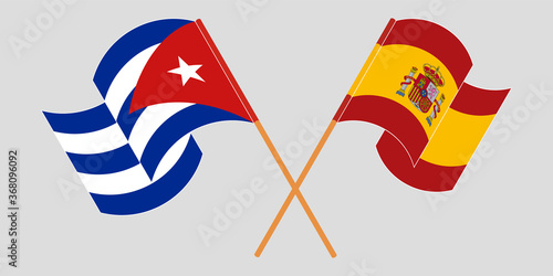 Crossed and waving flags of Cuba and Spain